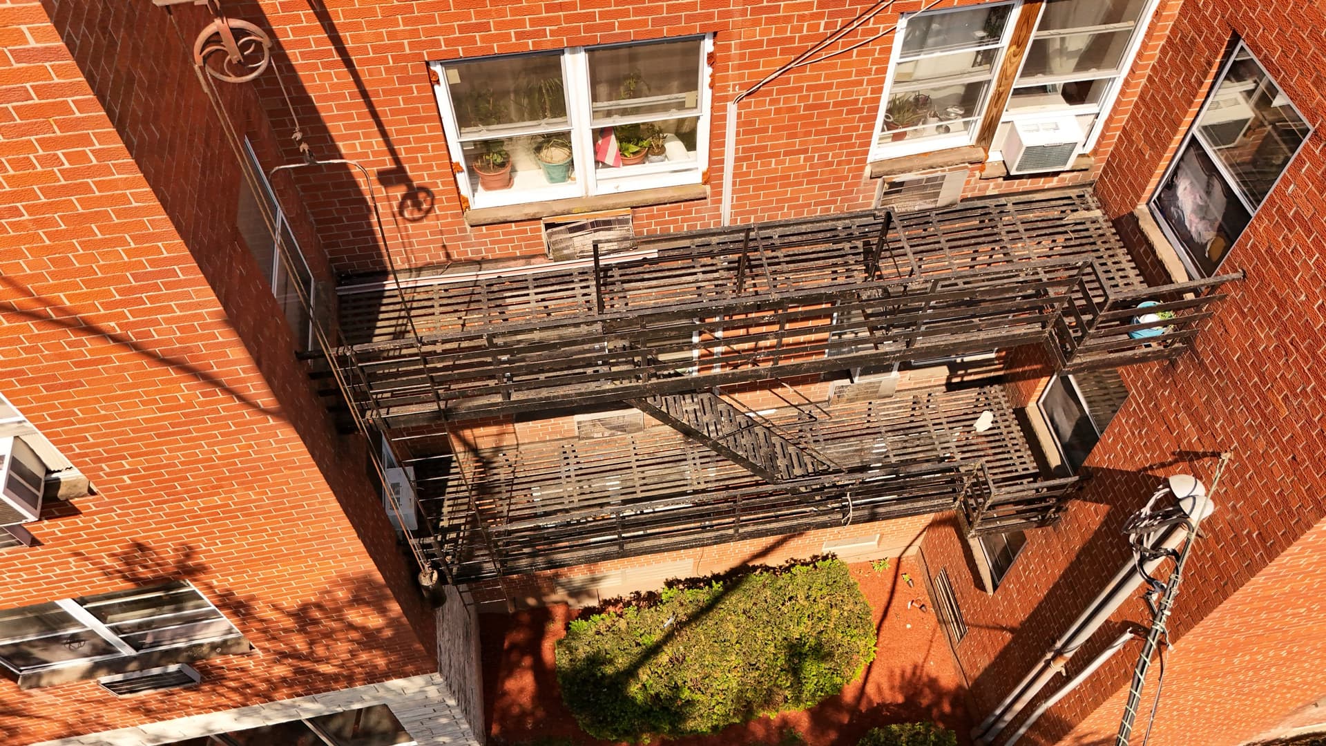 Fire escape platforms in a New Jersey apartment courtyard we inspected