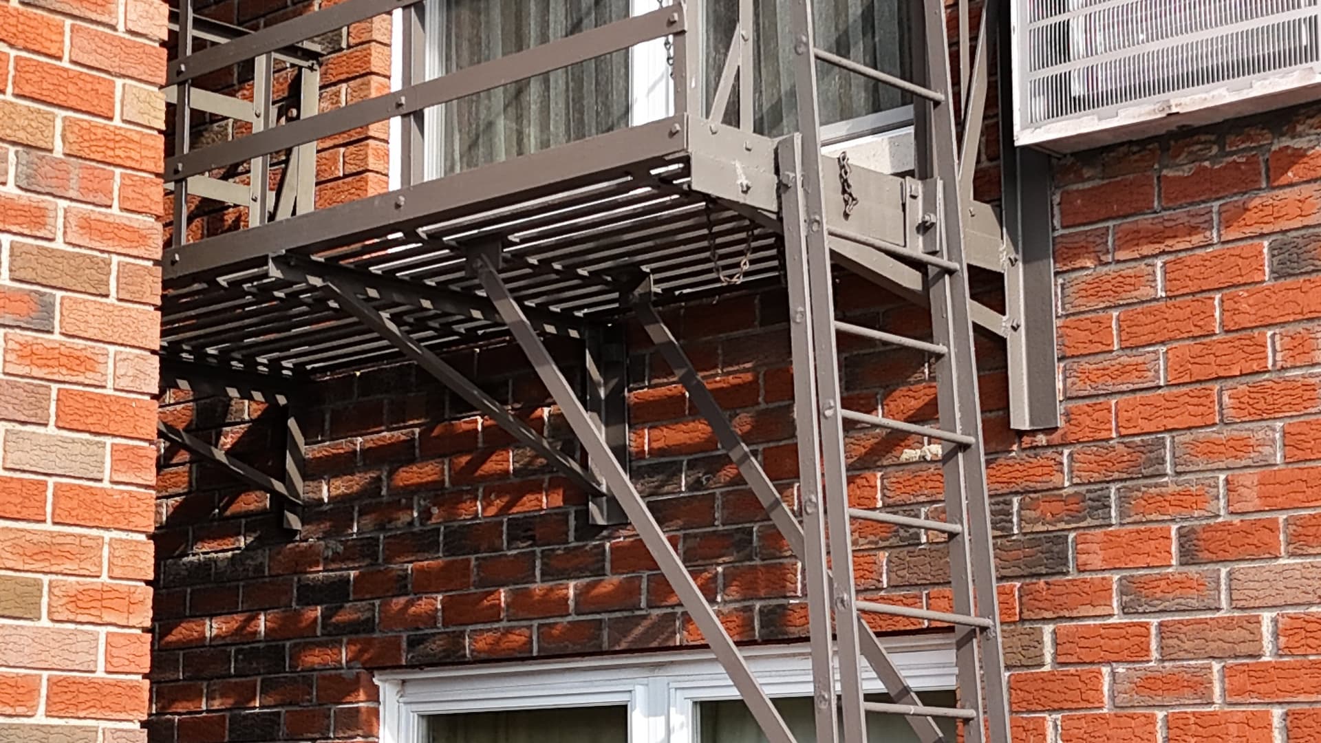 Close-up of fire escape ladder and platform components we inspected